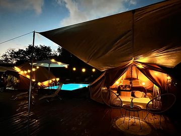 Bell tent lit up at night