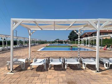 Pool with sun loungers