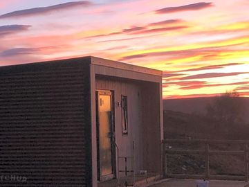 Sun setting over a pod