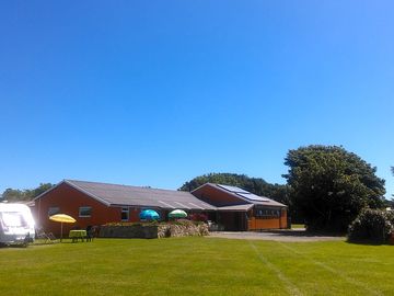 Serviced pitch by shower block and reception