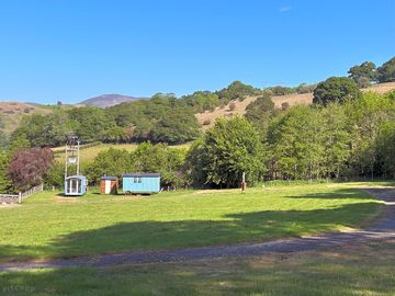 View of our shepherds huts from the caravan/motorhome area