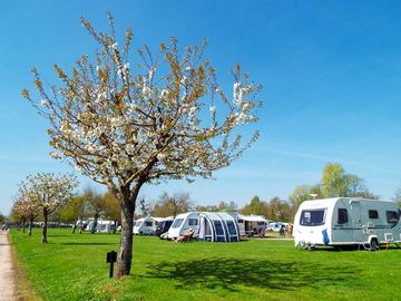 Touring field under blue skies