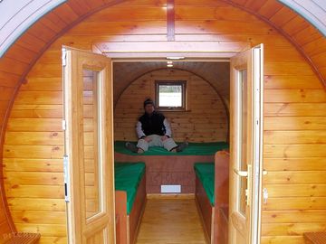 Weary camper, putting his feet up in one of our hobbits.