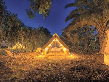Tents lit up in the evening