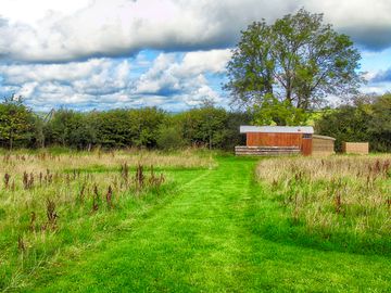 Grass pitch with toilet and shower block