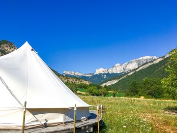 Bell tent set against a blue sky