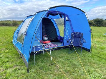 Hire tent with chairs, a table and cooking equipment