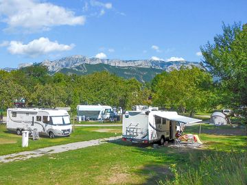 Level grass pitches with mountain views