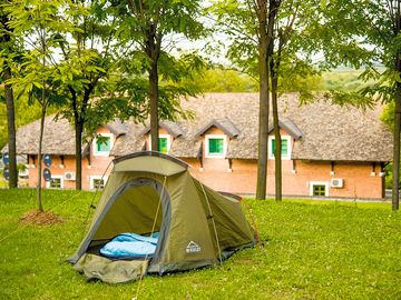 Grass tent pitch