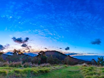 Setting sun from cleared ridge