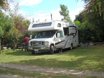 Motorhome pitch surrounded by trees