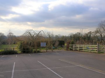 The car park and the entrance to the site
