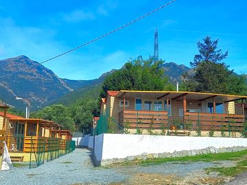 Cabins with a mountain backdrop