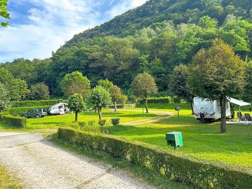 Pitches next to wooded slopes