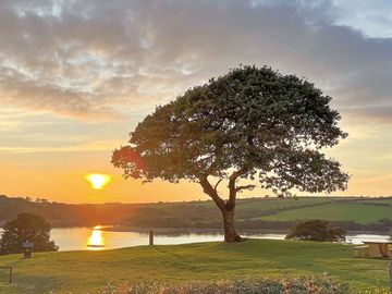 Sunset over the pitches and lake (added by manager 09 Aug 2023)