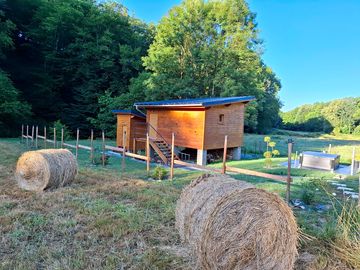 Lodge set in farmland and backed by trees
