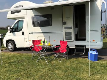 Motorhome serviced pitch with hardstanding and grass