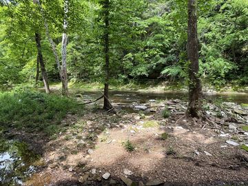Primitive camp site along the edge. not on rock. dirt, sand base.