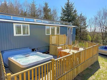 Outdoor space with hot tub