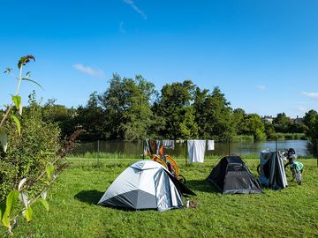 Grass pitches by the river