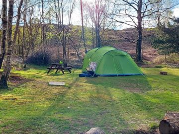 1 of 2 tent pitches. Include a fire pit and picnic table.