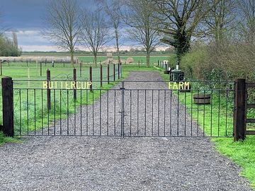 Extra-wide gated entrance to the site