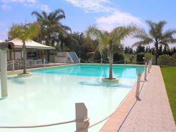 Pool area and solarium with kiosk bar