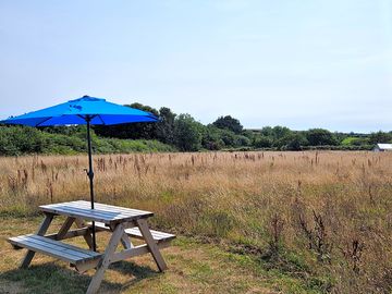 Picnic bench in front of the tent