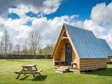 Each camping pod has its own picnic bench