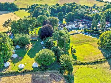 Aerial view of Croydon Hall and Starlit Glamping, with closeness of facilities shown
