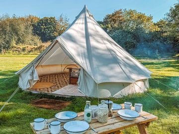 Bell tent and outdoor picnic table