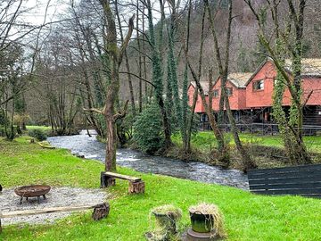 Firepit and seating by the river