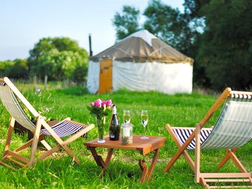 Enjoying the sunshine outside the yurts at Worcester Glamping