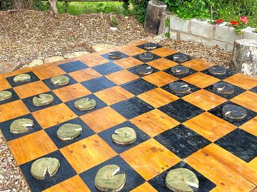 Have a go at our giant outdoor draughts board