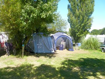 Tent pitches under the trees