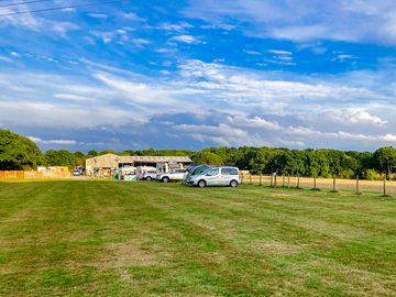 Visitor image of the field, and the farmhouse with minibar in the back