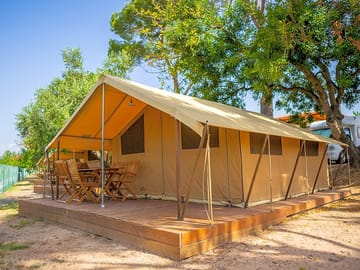 Safari tent on a wooden deck