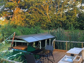 Set amongst the wildlife on the pond with your own private seating area