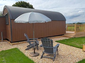 Outdoor seating at the side of the pod