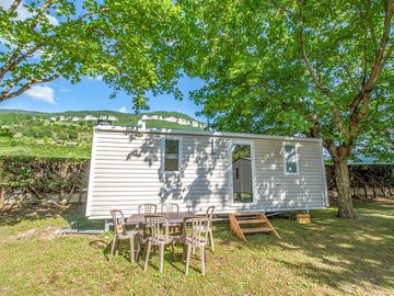 Static caravan with shaded outdoor area