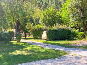 Grass pitches partially shaded by trees