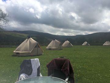 Each bell tent has an outdoor firepit