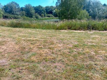 grass pitch overlooking lake