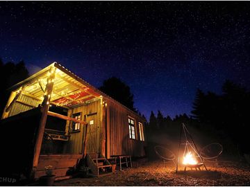 The Cabin with a beautiful star filled night sky