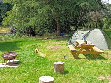 Comfortable spots for pitching your tent, with a mixture of sun and shade for comfort