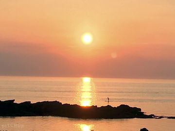 Sunset at the nearest beach of porth tywyn mawr