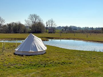 Bell tent by the pond