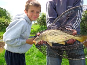 Nearly as big as the young man that caught this fine specimen in one of our coarse fishing ponds