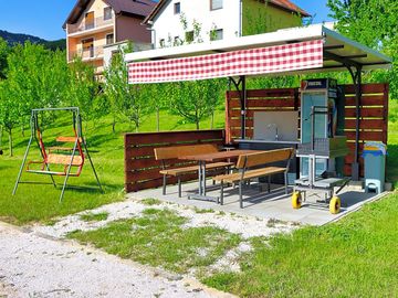 Barbecue area with a grill and seating