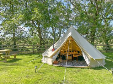 Bell tent with a picnic table
